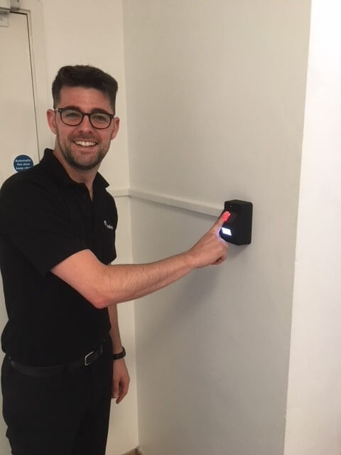 millenium-mats-staff-using-biometric-reader